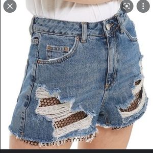 Topshop distressed denim fishnet shorts